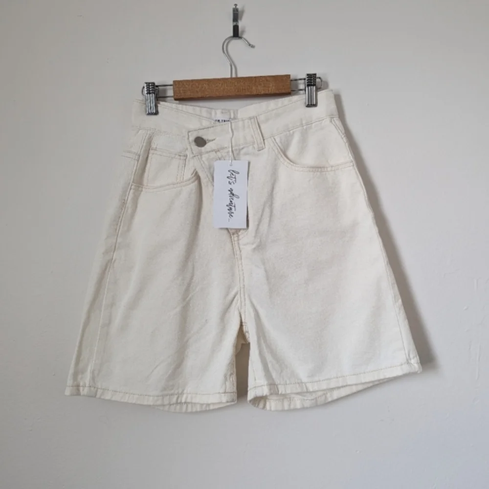 NWT‎ 12th Tribe bone off white ivory asymmetric crisscross Dylan denim shorts